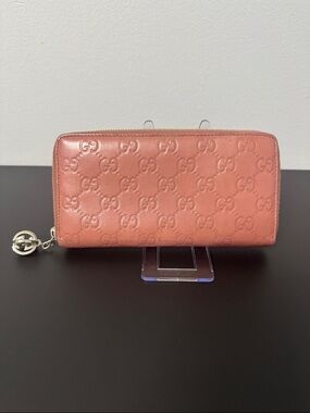 100% Authentic Gucci Pink Embossed Wallet with Silver Zipper Pull